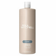 Bouteille de shampoing Paul Mitchell Classic Awapuhi 1L: de couleur beige avec étiquette bleu-vert, pour équilibrer l'hydratation, ajouter de la brillance et éliminer l'accumulation de résidus.