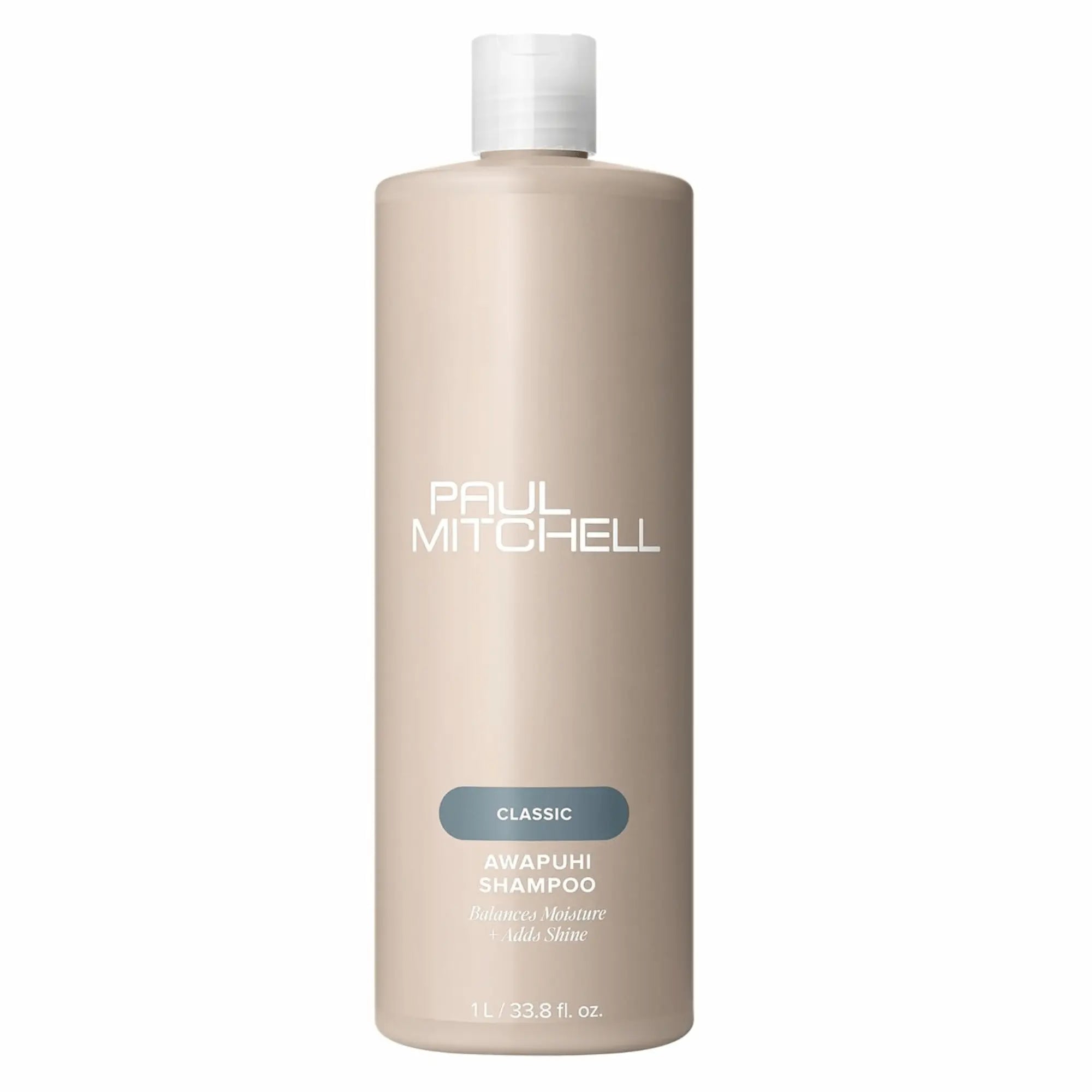 Bouteille de shampoing Paul Mitchell Classic Awapuhi 1L: de couleur beige avec étiquette bleu-vert, pour équilibrer l'hydratation, ajouter de la brillance et éliminer l'accumulation de résidus.