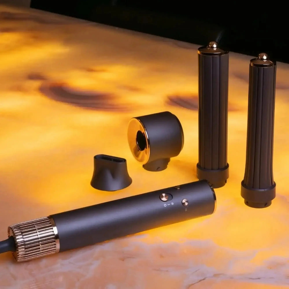 Appareil multicoiffant Aria Airstyler avec ses embouts interchangeables de lissage et de volume, présenté dans un design professionnel et ergonomique.