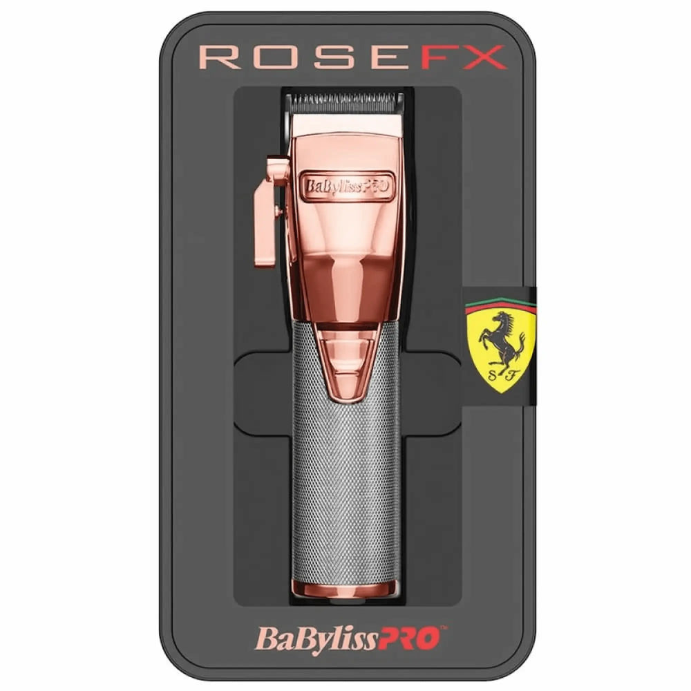 Tondeuse de coupe professionnelle BaBylissPRO ROSEFX avec moteur Ferrari, boîtier métallique rose doré et argenté dans sa boîte de présentation luxueuse.