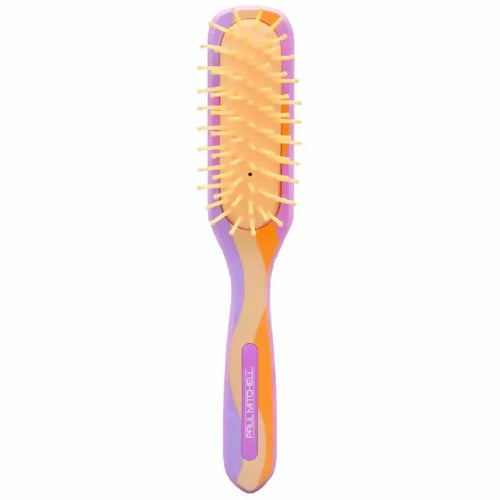 Brosse démêlante professionnelle Paul Mitchell à 7 rangées de picots, dotée d'un design ergonomique aux couleurs vives violet, orange et beige pour un lissage et un coiffage précis.