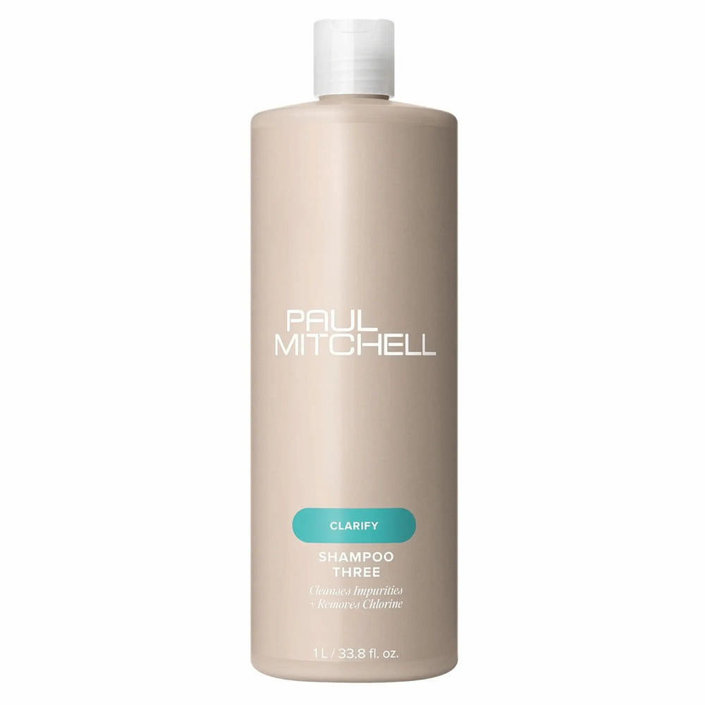 bouteille beige de shampoing clarifiant Paul Mitchell Shampoo Three 1L: pour éliminer les impuretés et le chlore.