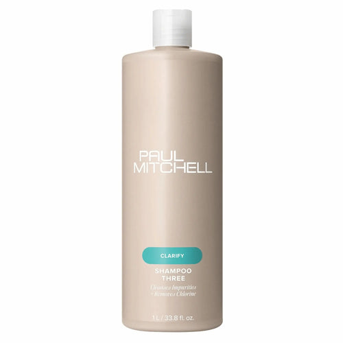 bouteille beige de shampoing clarifiant Paul Mitchell Shampoo Three 1L: pour éliminer les impuretés et le chlore.