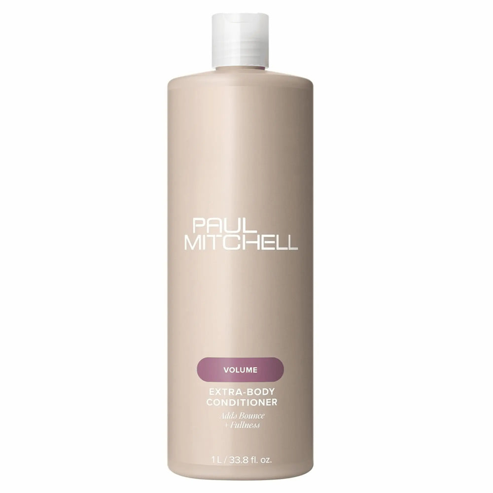 Bouteille beige de revitalisant Paul Mitchell Extra-Body 1L : étiquette mauve, pour ajouter du rebond et de la plénitude aux cheveux fins ou normaux.