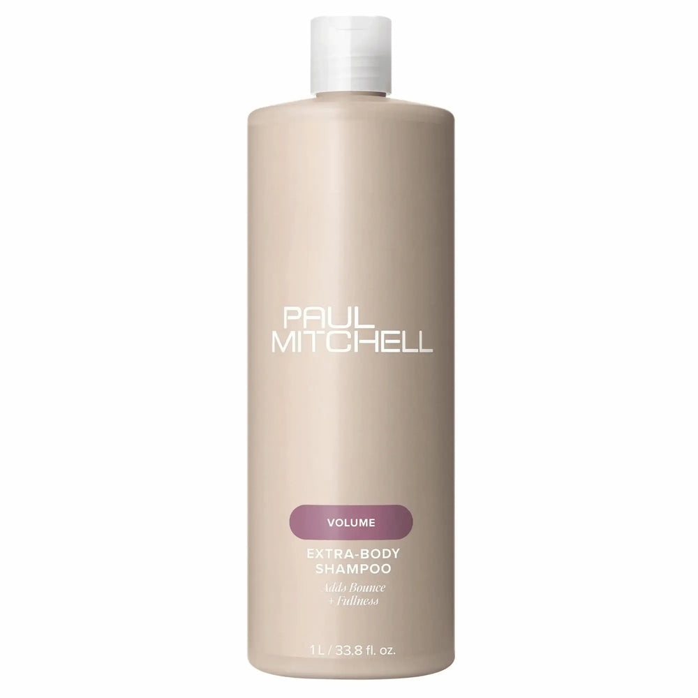 Bouteille beige de shampoing Paul Mitchell Extra-Body 1L : étiquette mauve, pour ajouter du volume, du rebond et de la plénitude aux cheveux fins ou normaux.