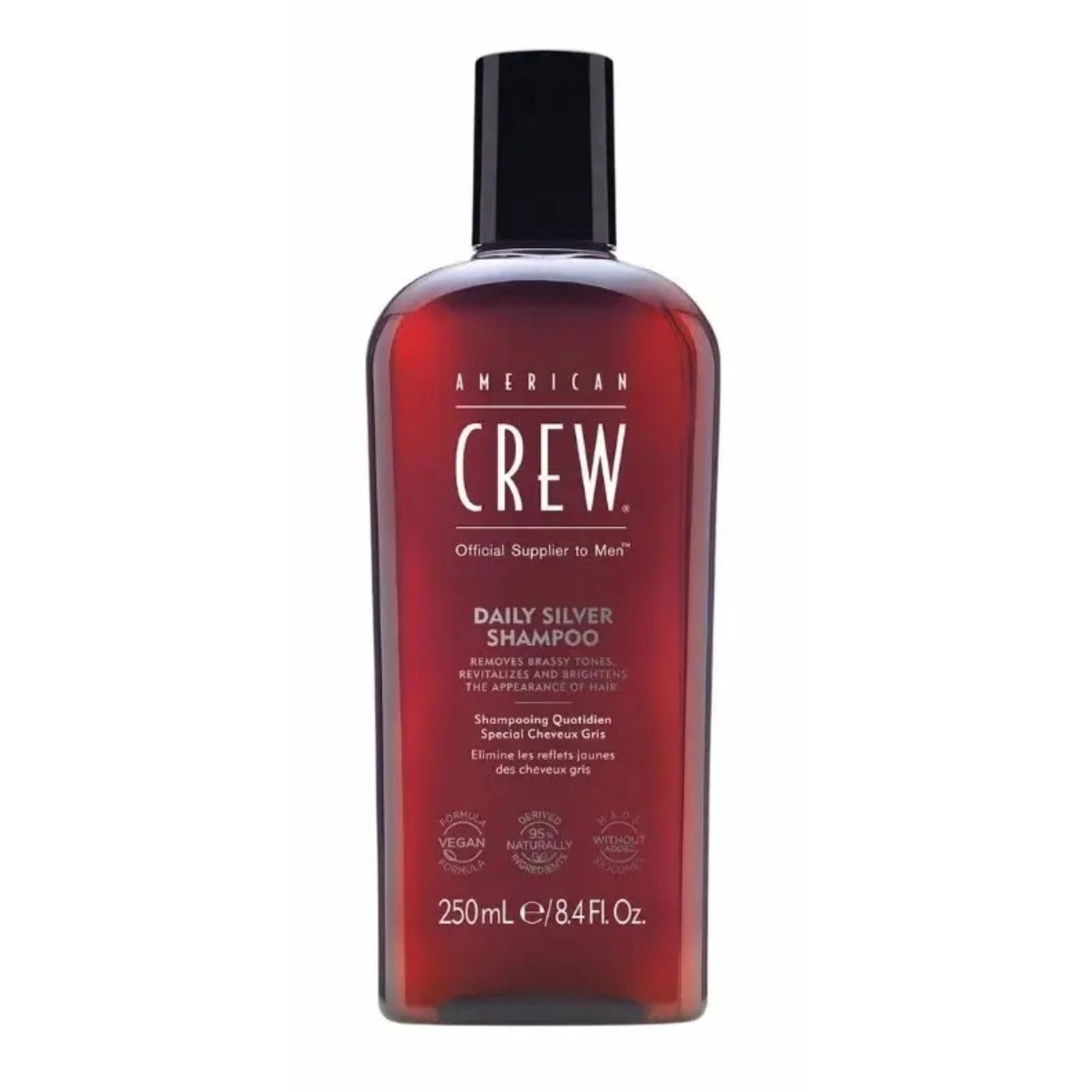 Flacon gris de shampoing American Crew Daily Silver avec bouchon noir, conçu pour neutraliser les reflets jaunes des cheveux gris.